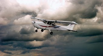 small plane in stormy sky